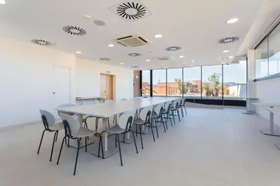 a large conference room with a long table and chairs at Hotel Terrassa Confort in Terrassa