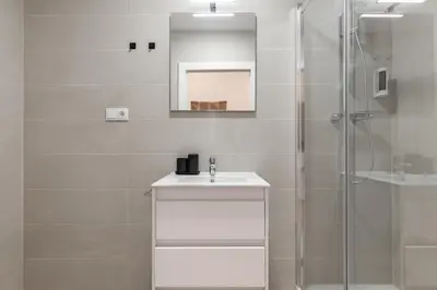 a bathroom with a sink and a shower at Calella Apartments by Olala Homes in Calella