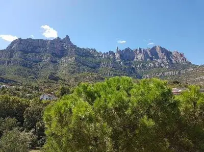 a view of a mountain range with trees and mountains at piso con vistas a la montaña in Monistrol