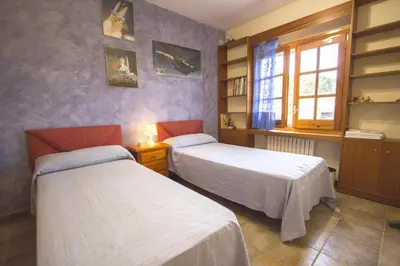 a room with two beds and a window at Catalunya Casas Private paradise - hop, skipjump to Barcelona! in Cervelló