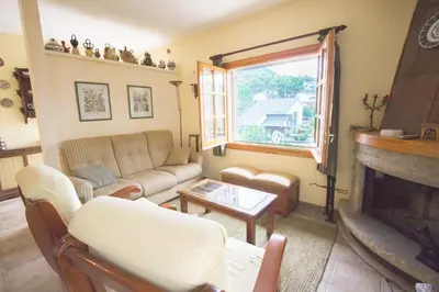 a living room with a couch and a fireplace at Catalunya Casas Private paradise - hop, skipjump to Barcelona! in Cervelló