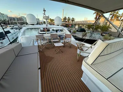 a deck of a boat with a table and chairs at YACHT 20Metros in Barcelona