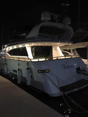 a white boat is parked in a dock at YACHT 20Metros in Barcelona