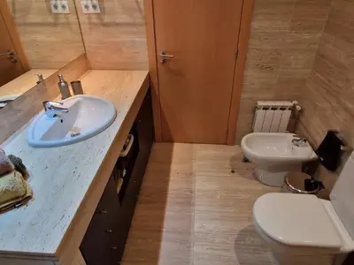 a bathroom with a sink and a toilet at Homing Sabadell 73 in Sabadell