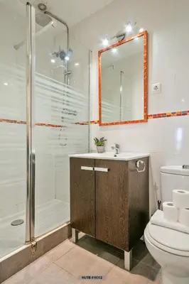 a bathroom with a shower and a toilet and a sink at Alcam Glorias in Barcelona