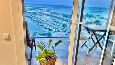 a balcony with a view of a marina at Apartamento playa in Arenys de Mar