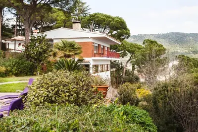 a house sitting on top of a hill at Wonderful house in the mountains with sea views in Cabrils