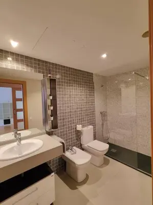 a bathroom with a toilet and a sink and a shower at Cozy apartment Forum beach in Sant Adria de Besos