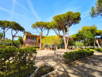 a house with trees in front of it at Apartamento loft en Castelldefels junto la playa in Castelldefels