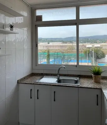 a kitchen with a sink and a window at Apartment Llavaneres near Barcelona Beach Pool in Sant Andreu de Llavaneres