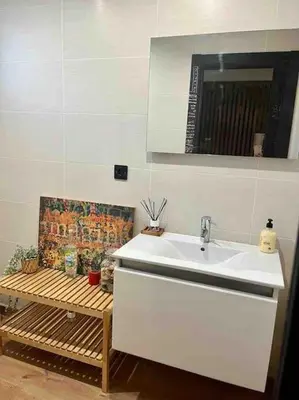 a bathroom with a sink and a wooden bench at Alma Castellana, Casa en plena Naturaleza in Dosríus