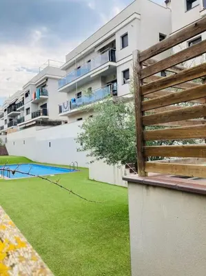 a view of a building with a yard with a playground at Alma Castellana, Casa en plena Naturaleza in Dosríus