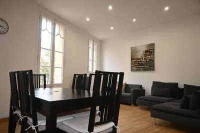 a living room with a table and chairs and a couch at Homenfun Barcelona Paseo de Gracia in Barcelona