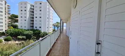 a balcony with a view of the ocean and buildings at Hauzify I Apartaments Can Pi in San Pol de Mar