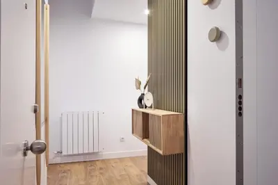 a room with a door with a vase on a shelf at CATERINA Gràcia in Barcelona