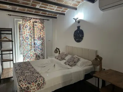 a bedroom with a bed and a window at Vilador Beach Hotel in Masnou