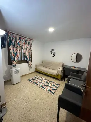a bedroom with a bed and a table and chairs at Can Ginesta Muy feliz&tranquilo in Barcelona