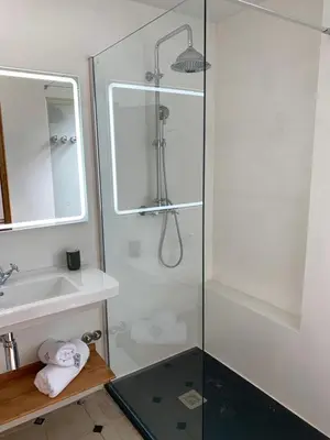 a bathroom with a shower and a sink at Ca l'Andreu Teià. Casa modernista in Teià