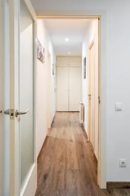 an alley in a city with buildings and plants at The Collection Barcelona - Paseo de Gracia Modern and cozy 3BD - 2BTh in Barcelona