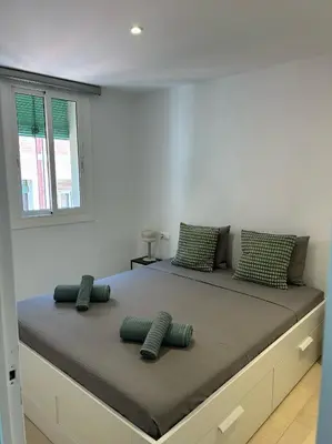 a bedroom with a large bed with pillows on it at Gaudi(M) Barcelona in Barcelona