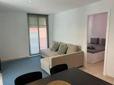 a living room with a couch and a table at Gaudi(M) Barcelona in Barcelona