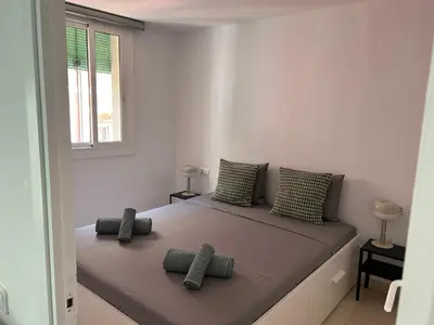 a bedroom with a large bed with two pillows on it at Gaudi(M) Barcelona in Barcelona