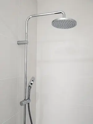 a shower with a shower head in a bathroom at L'Hostalet GuestHouse in Pineda de Mar