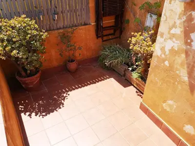 a courtyard with potted plants and a patio at A Home in Barcelona in Barcelona
