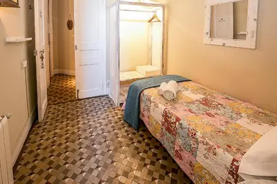 a bedroom with a bed with a hat on it at Casa del Mediterraneo in Barcelona