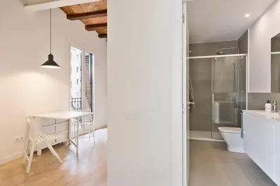 a bathroom with a sink and a toilet in a room at Modern and bright apartment well located in Gracia in Barcelona