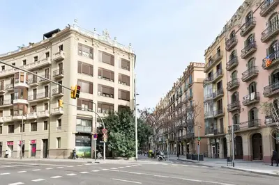 a traffic light on a city street with buildings at Modern and bright apartment well located in Gracia in Barcelona