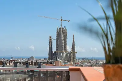 a view of a building under construction with a crane at Tendency Apartments Sagrada Familia Penthouse in Barcelona