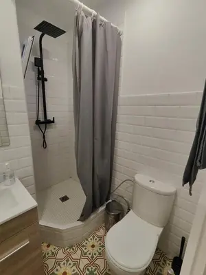 a bathroom with a toilet and a shower at Magnificent apartment Camp Nou in Hospitalet de Llobregat