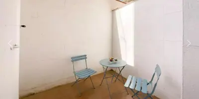 a living room with a couch and a table at Precioso Estudio en Sant Gervasio in Barcelona