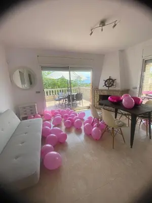 a room with a bunch of pink balloons on the floor at CAN TRULLEN CHALET CALAFELL in Calafell