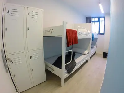 a room with two bunk beds and a closet at Room018BCN in Barcelona