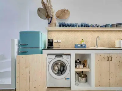 a kitchen with a washing machine in a kitchen at Casa Mandarina: 4 Bedrooms - 2 Terraces - Parking in Hospitalet de Llobregat