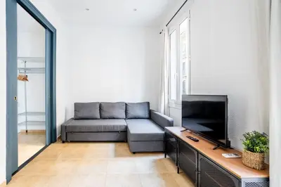 a bedroom with a bed with two yellow pillows at The Collection Barcelona - Private terrace Attico 3BD in Gran de Gracia in Barcelona