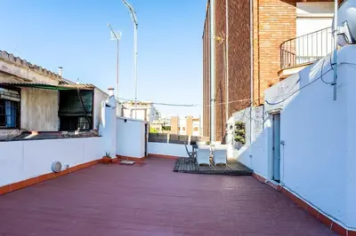 an empty balcony of a building with a patio at The Collection Barcelona - Private terrace Attico 3BD in Gran de Gracia in Barcelona