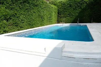 an overhead view of a swimming pool on a patio at Casa familiar en la playa con piscina in Teià