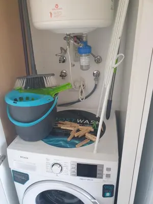 a washing machine with a white box and wires at Modern Loft in Terrassa in Terrassa