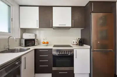 a kitchen with a sink and a stove top oven at BBarcelona Sagrada Familia Terrace Flat in Barcelona