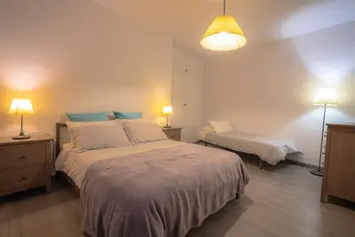 a bedroom with two beds and two lamps in it at Flat Top Manager in Barcelona