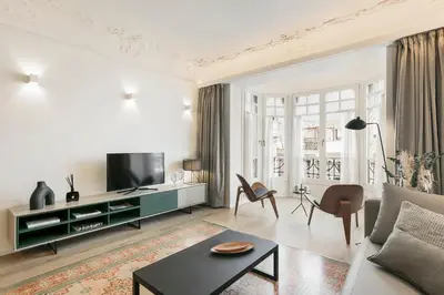 a living room with a couch and a table at BCN Town Apartments Portaferrissa in Barcelona