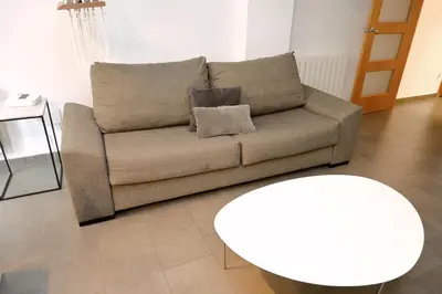 a living room with a couch and a table at Homenfun Barcelona Paseo de Gracia Diagonal in Barcelona