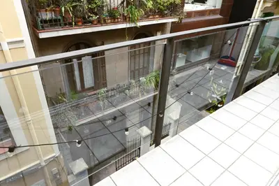 an overhead view of a balcony with plants at Homenfun Barcelona Paseo de Gracia Diagonal in Barcelona