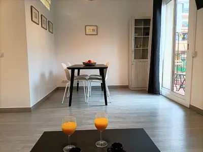 two glasses of orange juice sitting on a table at Suitur apartamento floridablanca barcelona in Barcelona