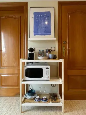 a refrigerator filled with milk and other food items at Habitación Atalaya in Olivella