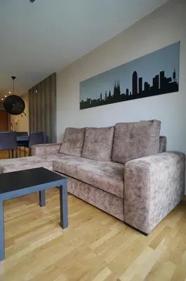 a living room with a couch and a table at Fira Gran Via - Barcelona4Seasons in Hospitalet de Llobregat