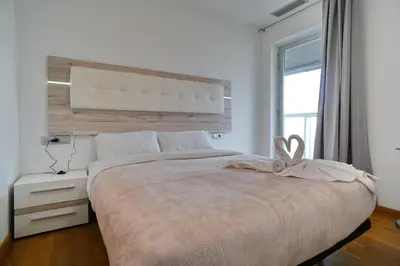 a bedroom with a large bed and a window at Fira Gran Via - Barcelona4Seasons in Hospitalet de Llobregat
